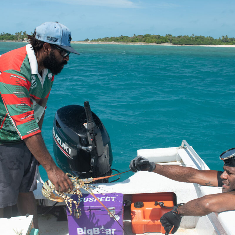 Boat with two people and Lobster